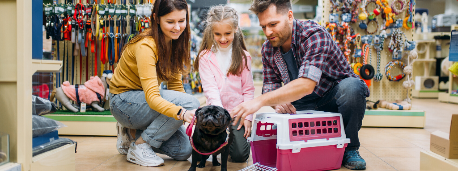 Family shopping for pet supplies with pug